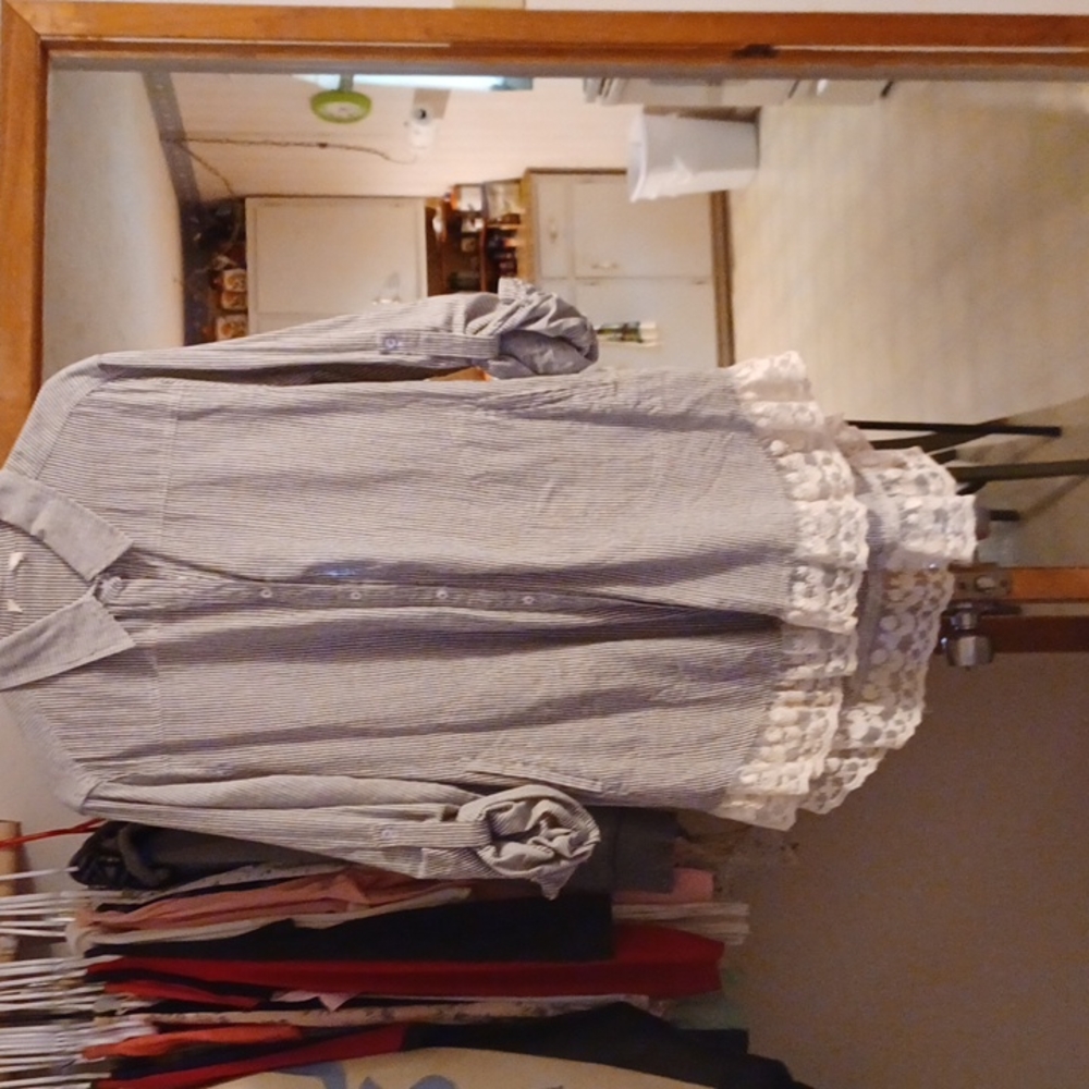 Long sleeved button up front shirt.